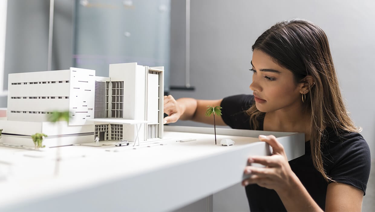 Markets-Architects-Woman-with-Building-Model